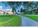 Scenic park with gazebo, palm trees, and walking path at sunset at 2959 Bay St, Sarasota, FL 34237