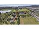 An aerial view of a large property with multiple structures, including the main house at 3200 Rowland Dr, Punta Gorda, FL 33980