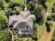 Aerial view of home with screened patio and landscaped yard at 3200 Rowland Dr, Punta Gorda, FL 33980