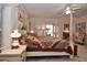 Bedroom with a four poster bed, nightstands and carpeted floors at 3200 Rowland Dr, Punta Gorda, FL 33980