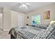 Bedroom featuring two twin beds, ceiling fan, and neutral decor at 3200 Rowland Dr, Punta Gorda, FL 33980
