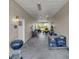 Covered carport with lawn equipment, grill, and storage at 3200 Rowland Dr, Punta Gorda, FL 33980