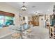 Dining space featuring a glass-top table, traditional hutch, and ample natural light at 3200 Rowland Dr, Punta Gorda, FL 33980