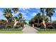 Gated entrance to Tall Palms Ranch with horse statues and lush landscaping at 3200 Rowland Dr, Punta Gorda, FL 33980