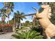 Gated entrance to Tall Palms Ranch with horse statue and palm trees at 3200 Rowland Dr, Punta Gorda, FL 33980