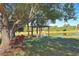Gazebo overlooking a pond with a large tree at 3200 Rowland Dr, Punta Gorda, FL 33980