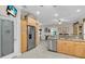 Kitchen with stainless steel appliances, wood cabinets, a pantry, and breakfast nook area at 3200 Rowland Dr, Punta Gorda, FL 33980