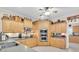 Kitchen showcasing corner cabinets, stainless steel appliances, and wood cabinetry at 3200 Rowland Dr, Punta Gorda, FL 33980