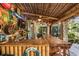 Outdoor bar area with a thatched roof, wooden countertop, and plenty of seating at 3200 Rowland Dr, Punta Gorda, FL 33980
