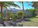 Large screened patio surrounded by tropical plants at 3200 Rowland Dr, Punta Gorda, FL 33980