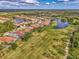 Community features various homes surrounding a golf course and lake at 3984 Whispering Oaks Dr, North Port, FL 34287