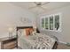 Guest bedroom with queen bed and window shutters at 3984 Whispering Oaks Dr, North Port, FL 34287