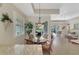 Kitchen breakfast nook with glass-top table and wicker chairs at 3984 Whispering Oaks Dr, North Port, FL 34287