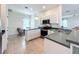 Bright kitchen with stainless steel appliances and ample counter space at 4231 Tennyson Way, Venice, FL 34293