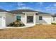 Modern house with a welcoming front entrance and lush landscaping at 441 Boundary Blvd, Rotonda West, FL 33947