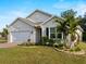 One-story house with white garage door and landscaping at 486 Chubut Ct, Punta Gorda, FL 33983