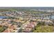 Aerial view of a beautiful community with houses, lakes, and a pool at 5255 Athens Way, Venice, FL 34293