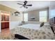 Main bedroom with king bed, coastal bedding, and en-suite bathroom at 5255 Athens Way, Venice, FL 34293