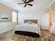 Guest bedroom with a queen-size bed and coastal decor at 5255 Athens Way, Venice, FL 34293