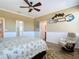 Bedroom with king-size bed and coastal decor at 5255 Athens Way, Venice, FL 34293