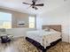 Main bedroom with a king-size bed and coastal decor at 5255 Athens Way, Venice, FL 34293