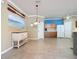 Open dining area with coastal-themed wall art at 5255 Athens Way, Venice, FL 34293