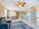 Open-concept living area with dining space and beachy decor at 5255 Athens Way, Venice, FL 34293