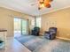 Living room with two armchairs and access to a screened patio at 5255 Athens Way, Venice, FL 34293