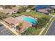 Community pool with plenty of lounge chairs for relaxation at 5255 Athens Way, Venice, FL 34293