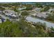 Aerial perspective of the building nestled within a residential area near the water at 533 Parkdale Mews # 533, Venice, FL 34285