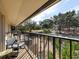Balcony with seating area, overlooking a park-like setting at 533 Parkdale Mews # 533, Venice, FL 34285