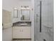 Modern bathroom with granite vanity and glass shower at 533 Parkdale Mews # 533, Venice, FL 34285