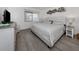 King-size bed, wood floors and coastal decor at 533 Parkdale Mews # 533, Venice, FL 34285