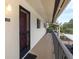 Exterior view of condo with walkway and balcony access at 533 Parkdale Mews # 533, Venice, FL 34285