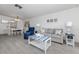 Coastal-themed living area with comfortable seating and coordinated decor at 533 Parkdale Mews # 533, Venice, FL 34285