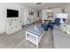 Spacious living room with comfortable seating, entertainment center, and dining area at 533 Parkdale Mews # 533, Venice, FL 34285
