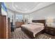 Bright main bedroom featuring wood floors, a patterned rug, and large windows with plantation shutters at 5584 Cantucci St, Nokomis, FL 34275