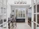 Office space with shuttered window, French doors and unique decor at 5584 Cantucci St, Nokomis, FL 34275