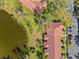 Aerial view of villa and community by the lake at 5635 Golf Pointe Dr # 105, Sarasota, FL 34243