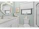 Bathroom with white vanity, granite countertop and a shower/tub combo at 5635 Golf Pointe Dr # 105, Sarasota, FL 34243