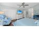 Main bedroom with king bed, white dresser and coastal decor at 5635 Golf Pointe Dr # 105, Sarasota, FL 34243