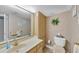 Updated bathroom with a vanity, toilet and linen closet at 629 Alhambra Rd # 704, Venice, FL 34285