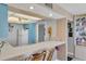 Kitchen features white appliances and light blue cabinets at 629 Alhambra Rd # 704, Venice, FL 34285
