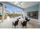 Spacious screened patio with seating area overlooking a pool at 676 Eagle Watch Ln, Osprey, FL 34229