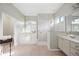 Bright bathroom featuring large walk-in shower, soaking tub and dual sink vanity at 6930 Treymore Ct, Sarasota, FL 34243