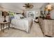 Charming bedroom with a post bed, dresser, and access to the pool at 7173 Antigua Pl, Sarasota, FL 34231