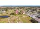 Wide aerial view of community and surrounding golf course at 758 Village Cir # 106, Venice, FL 34292