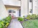 Condo entry with bicycle and landscaping at 758 Village Cir # 106, Venice, FL 34292