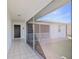 Screened porch entryway with tiled floor and access to backyard at 7727 36Th E Ln, Sarasota, FL 34243