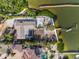 Captivating overhead shot of home with pool, dock, and water access at 7825 Manasota Key Rd, Englewood, FL 34223